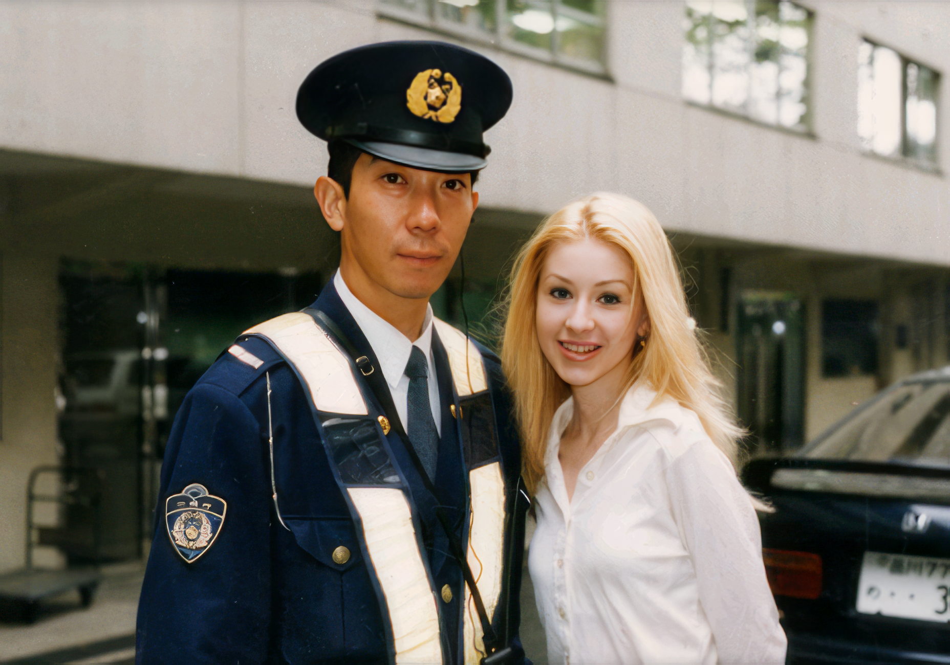 Christina, age 15, with a Japanese policeman.
Christina, age 15, with a Japanese policeman.