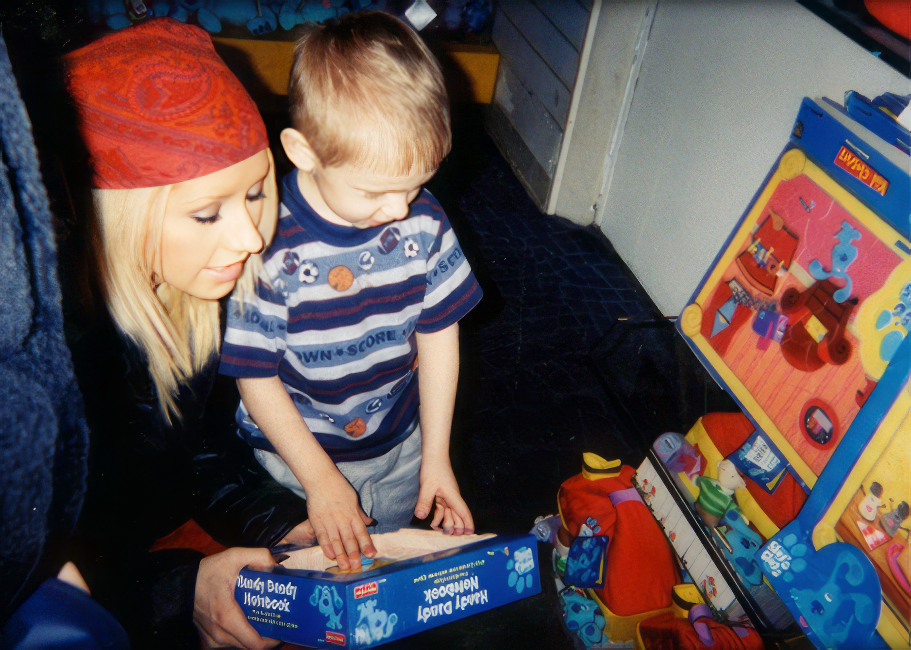 Christina, age 18, showing toys to her little brother Mikey at FAO Schwartz in New York City.
Christina, age 18, showing toys to her little brother Mikey at FAO Schwartz in New York City.